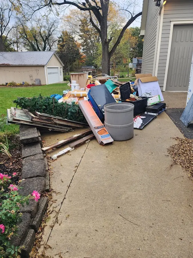 Dumpster being loaded with debris for 30 Yard Dumpster Rental in Evansdale
